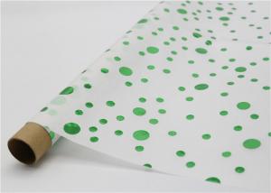 Metallic Green Dots Patterned Tissue Paper Wax On The Paper Surface