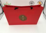 Red Coated Paper Printed Gift Bags With Handles For Cosmetics Packaging