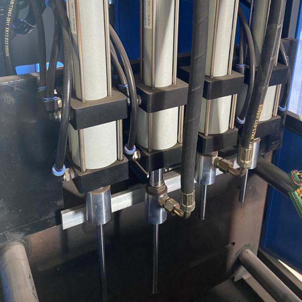 Semi-automatic 4 cavity PET bottle blow molding machine with DELTA PLC