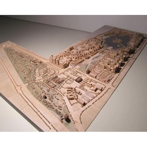 Architectural Model of a Modern Urban Complex with Illuminated Buildings and Landscaped Features