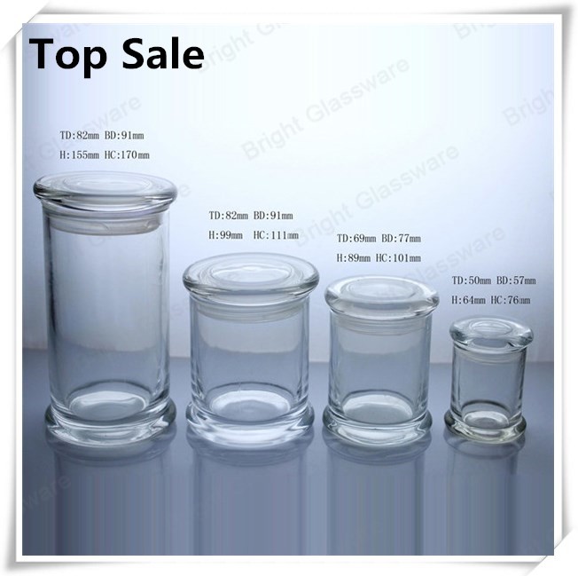 a series of different size glass jars for candles in stock