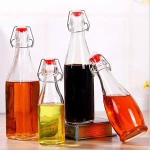 Wholesale Glass Bottle Sealing Type Cork 150ml 250ml 500ml 1000ml Round Shape Swing Top Wine Whiskey Bottles from china suppliers