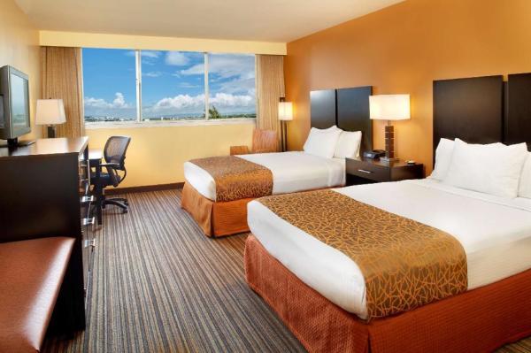 Jogja hotel interior design of guestroom furniture wood panel headboard and
