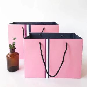 Wholesale Washable 21x11x27cm 350g UV CMYK 160gsm Non Woven Paper Bag from china suppliers