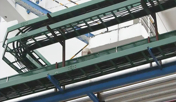 Production line with multiple cable tray machines